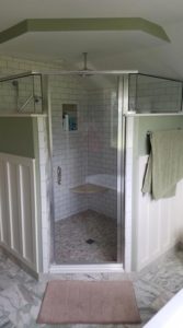 Home Contractor Concordville PA - Corner shower with custom tile and wainscoating.