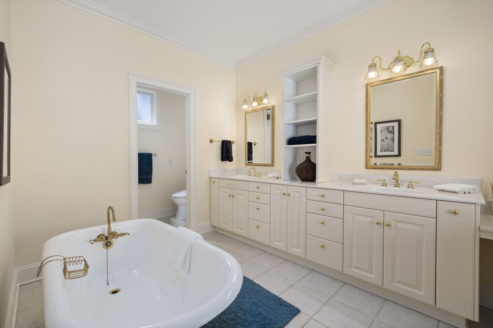 Bathroom with clawfoot tub and double vanity