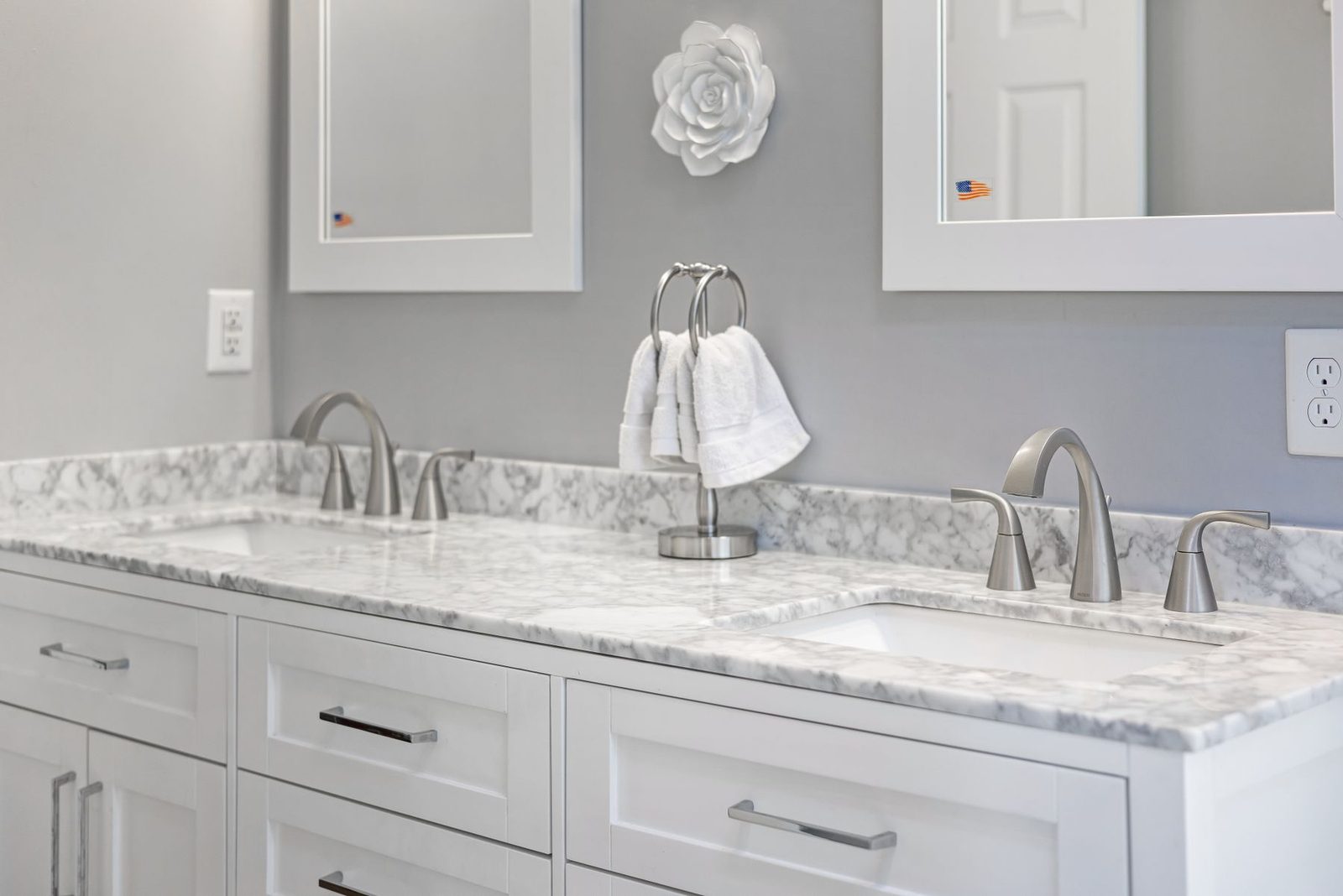 Bathroom with marble countertop and dual sinks