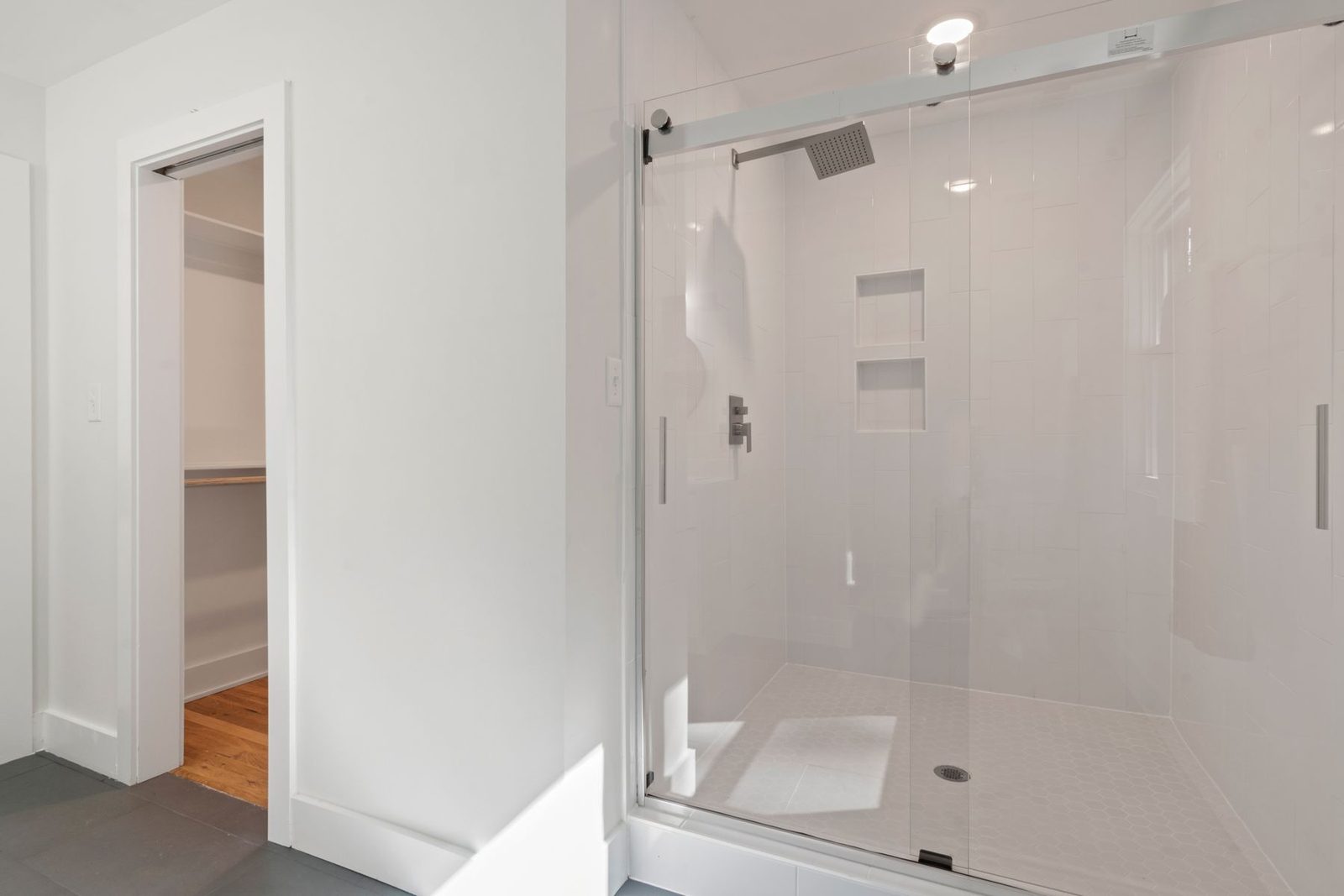 Bright bathroom with glass-enclosed shower – bathroom remodeling Ocean City