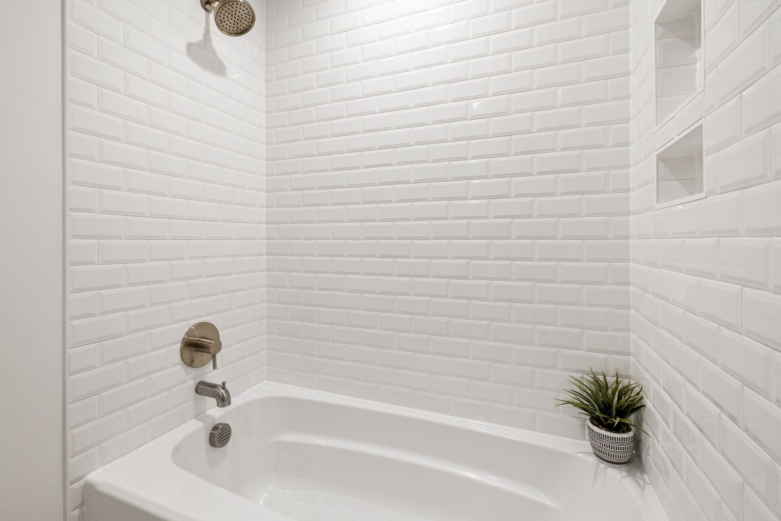 Bright bathroom with white subway tile and bathtub – bathroom remodeling Ocean City