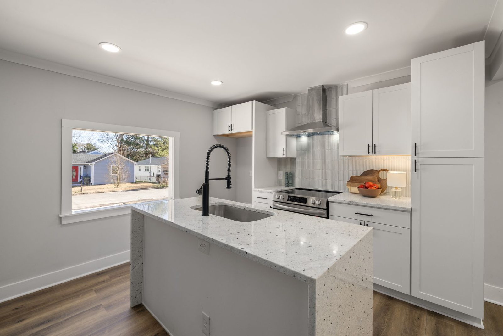 Bright kitchen with marble countertop and white cabinets – Ventnor NJ remodeling