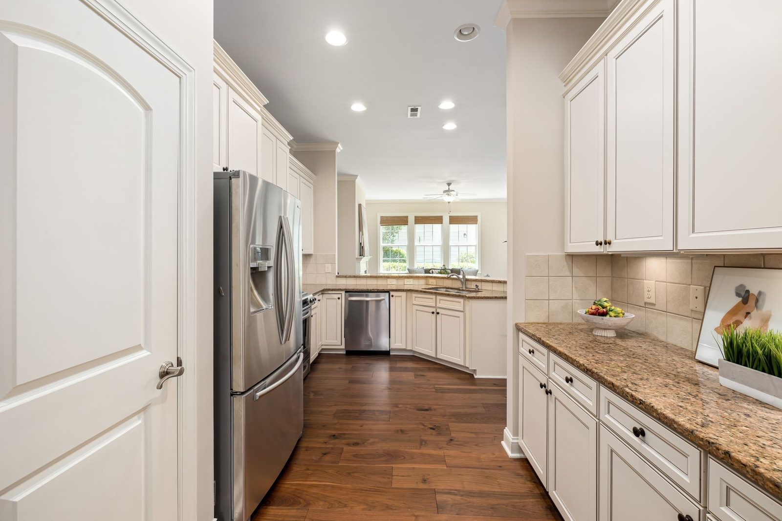 Bright kitchen with white cabinetry and stainless steel appliances – Longport NJ remodeling