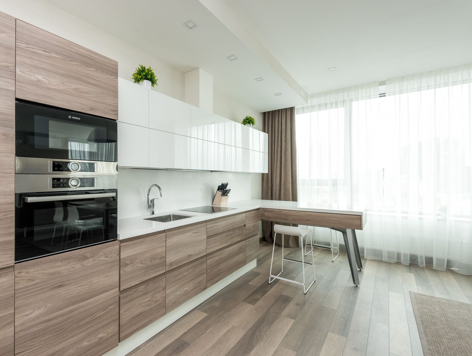 Bright modern kitchen with sleek cabinetry and light wood flooring – kitchen remodeling Ocean City