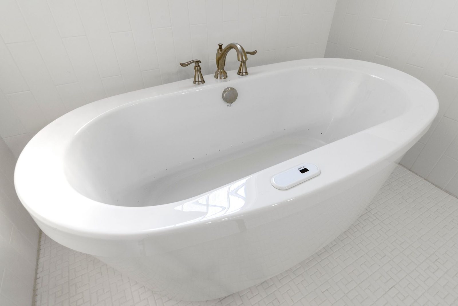 Freestanding white bathtub in a minimalist bathroom – bathroom remodeling Ocean City