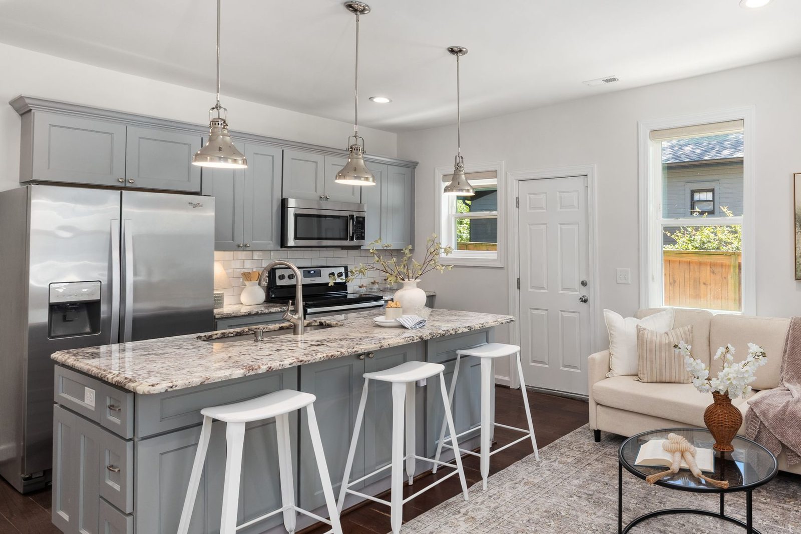 Grey kitchen with granite island and pendant lights – Stone Harbor NJ remodeling