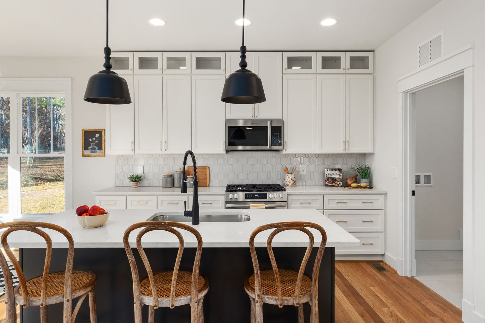 Kitchen with island, white cabinets and black pendant lights – Somers Point NJ remodeling