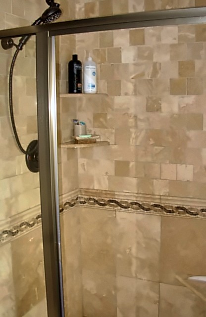 Portfolio photo: Tile shower with glass door and decorative tile band