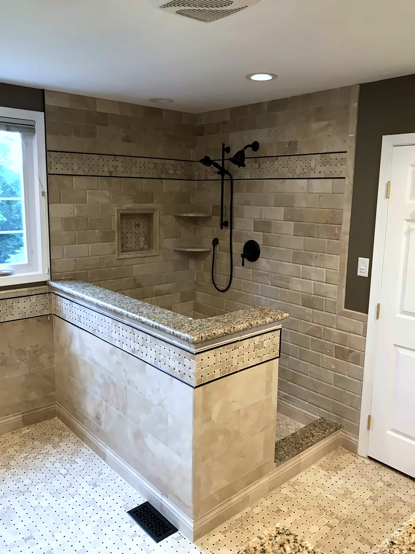 Portfolio photo: Tile walk-in shower with niche and half wall