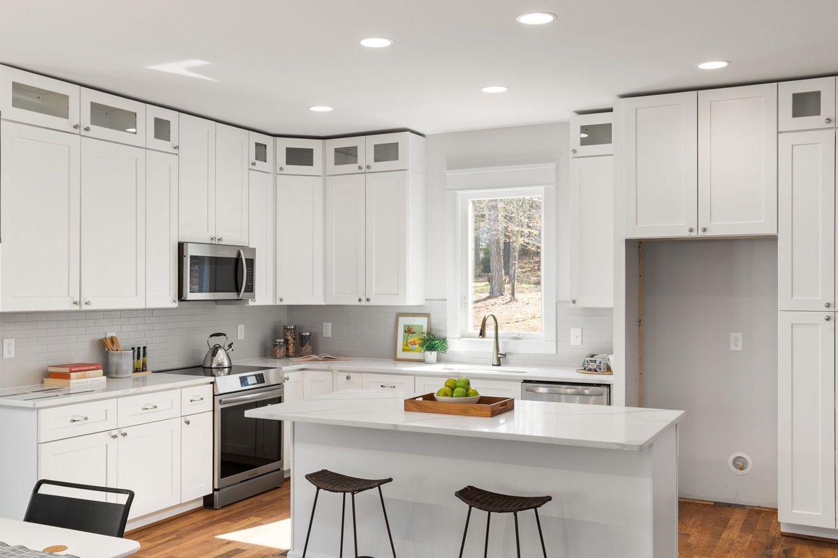 White kitchen with island – condo kitchen