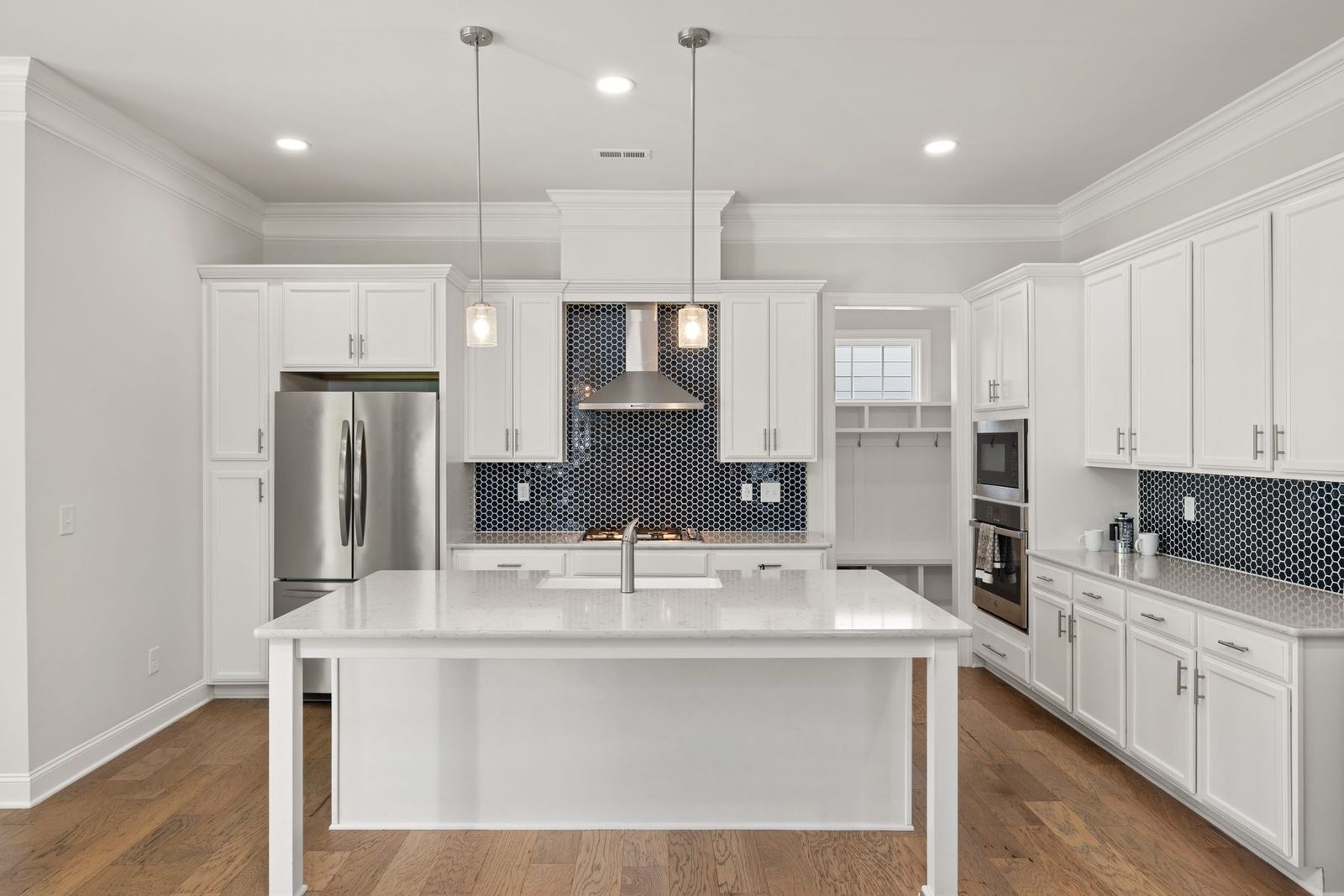 White kitchen with central island and wood flooring – remodel permit guide