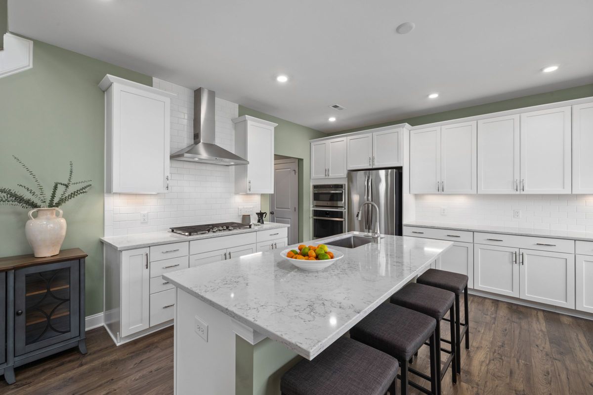 White shaker kitchen with quartz island – Ocean City home remodeling
