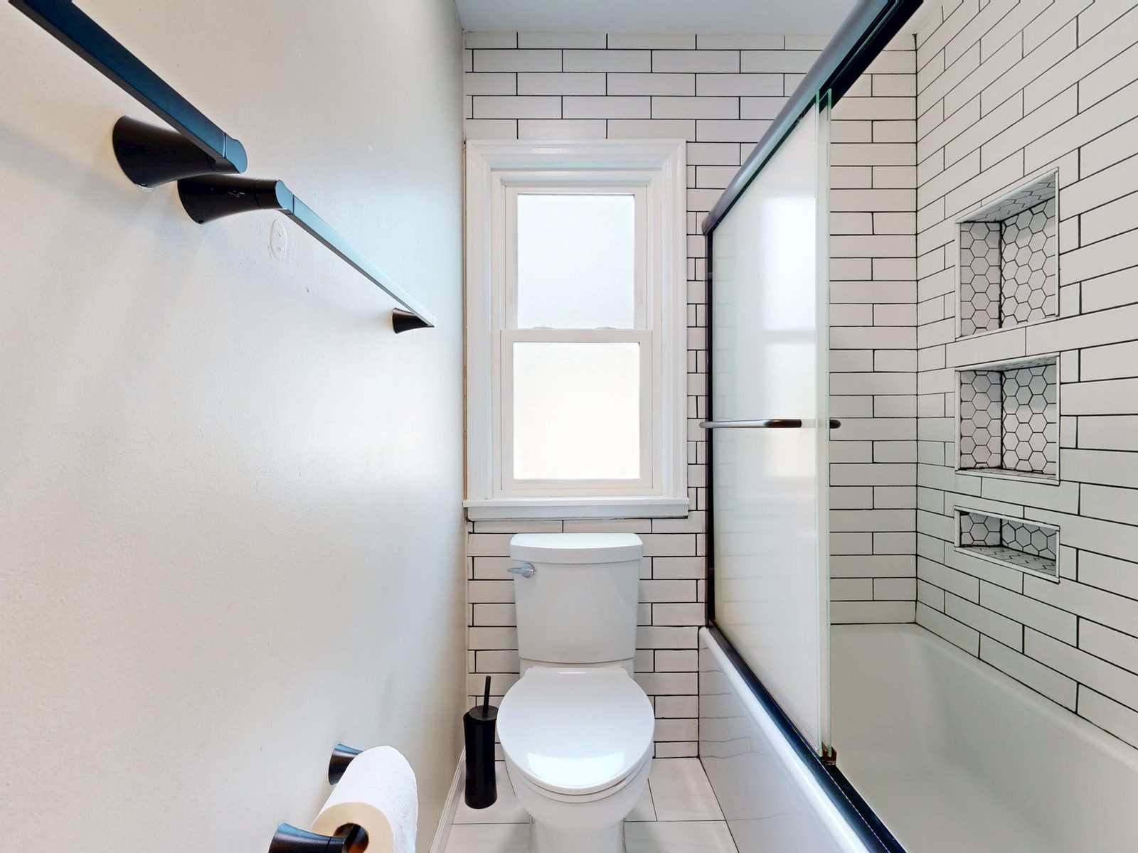 White subway tile bathroom with glass shower
